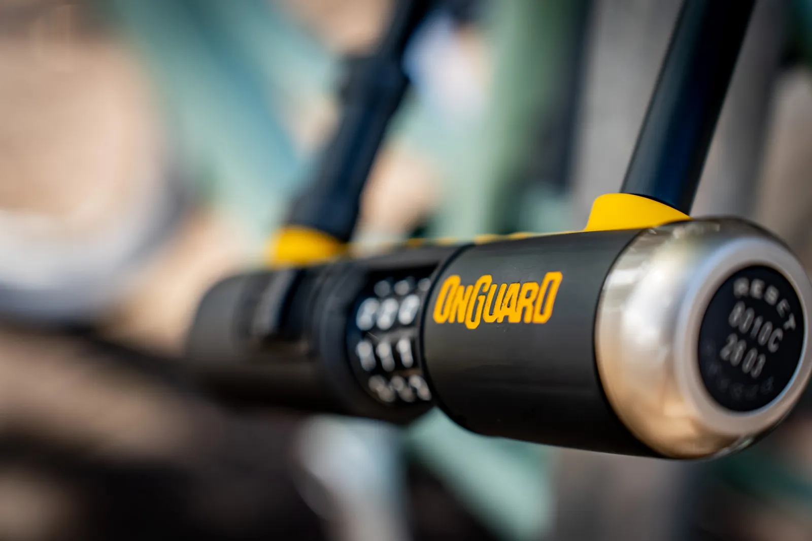 Close-up of the OnGuard crossbar and chrome end cap on the Bulldog 8010C