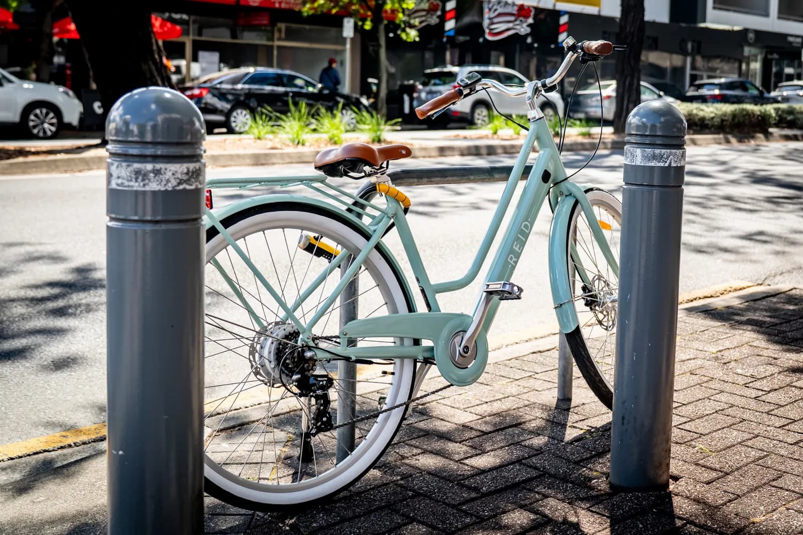Reid Classic e-bike parked at a street rack with the OnGuard Bulldog 8010C fitted