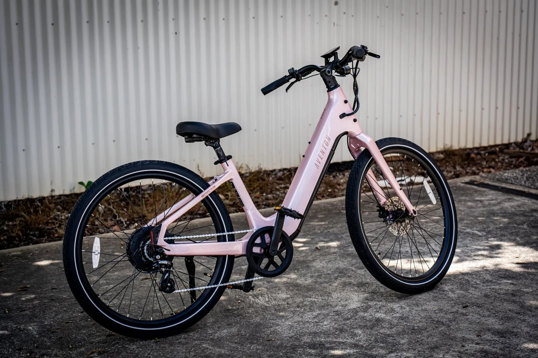 Pink Aventon Pace 5 REC ST three-quarter rear view on concrete