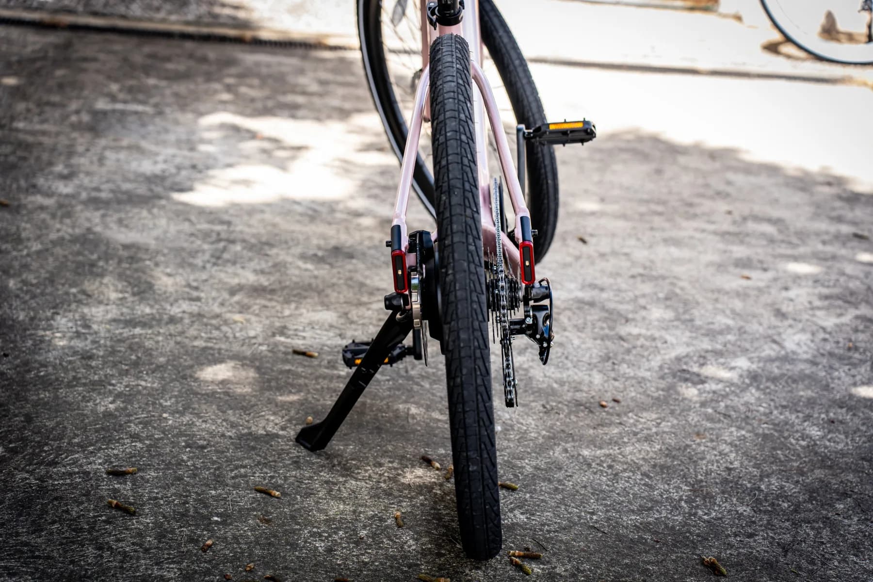 Rear view of the Aventon Pace 5 REC ST showing the red rear lights and indicators on the seat stays